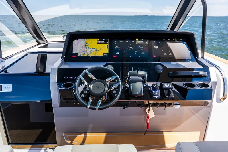 Slide: The Image of Cockpit of 2027 Pardo Yachts P43R with advanced navigation system and steering wheel. - 53