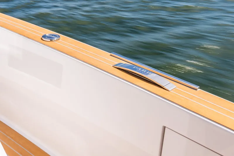 Slide: The Image of 2027 Pardo Yachts P43R deck detail with sleek design and water backdrop. - 40