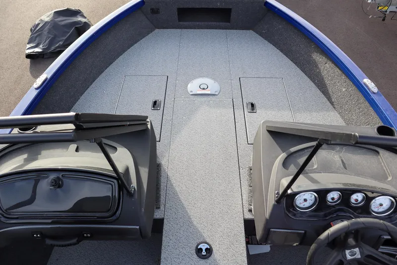 Slide: The Image of 2026 Crestliner 1750 Hawk boat interior with dashboard and storage compartments. - 12
