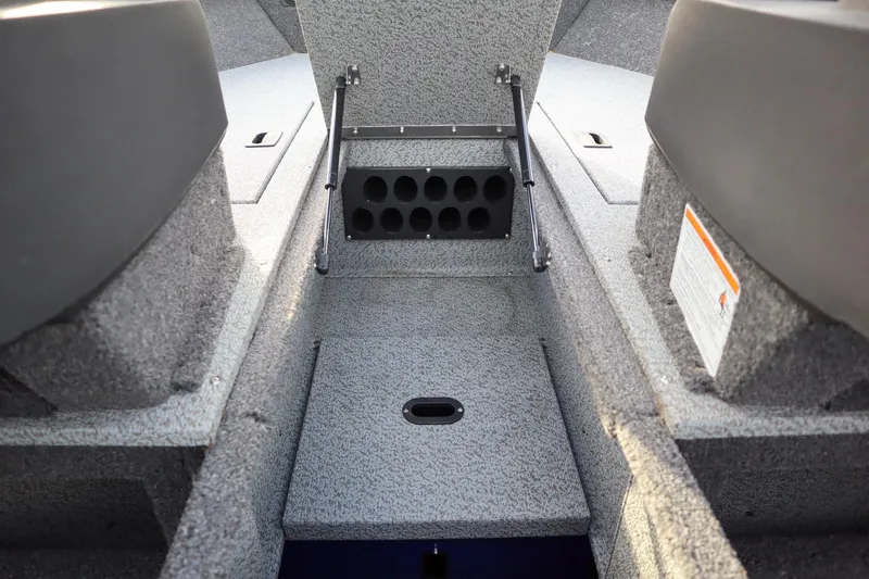 Slide: The Image of Interior view of 2026 Crestliner 1750 Hawk boat, featuring storage compartments. - 13