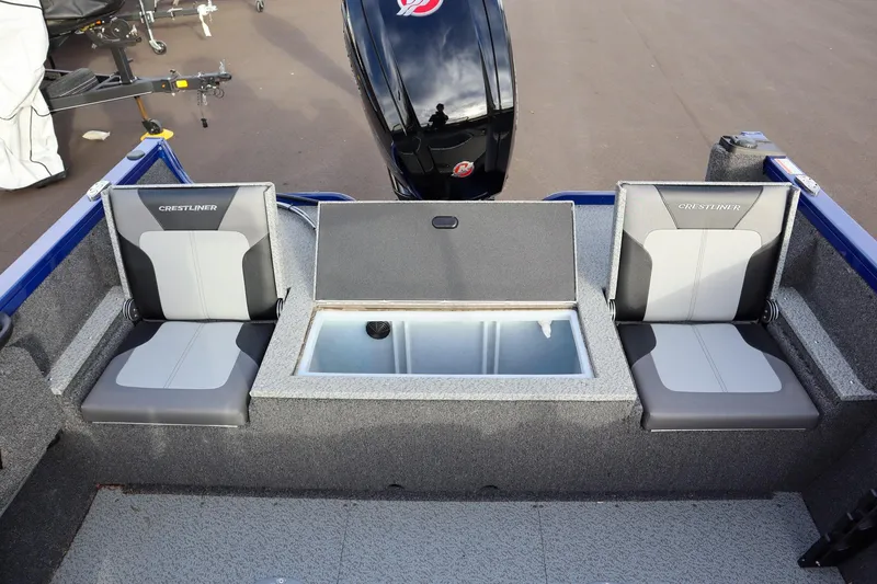 Slide: The Image of 2026 Crestliner 1750 Hawk boat interior with seating and storage compartment. - 7