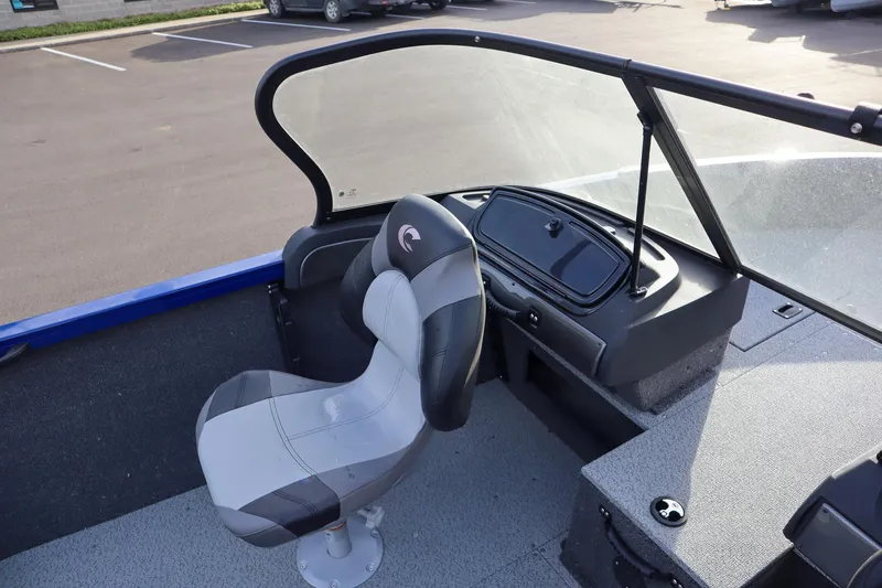 Slide: The Image of 2026 Crestliner 1750 Hawk boat interior with captain's chair and windshield. - 8