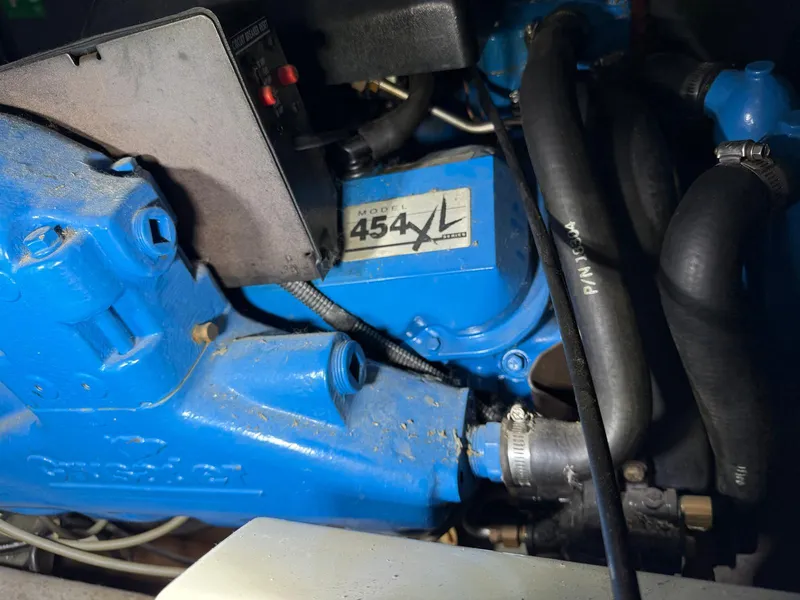 Slide: The Image of 1994 Carver 390 engine, Model 454XL, with blue components and visible hoses. - 7