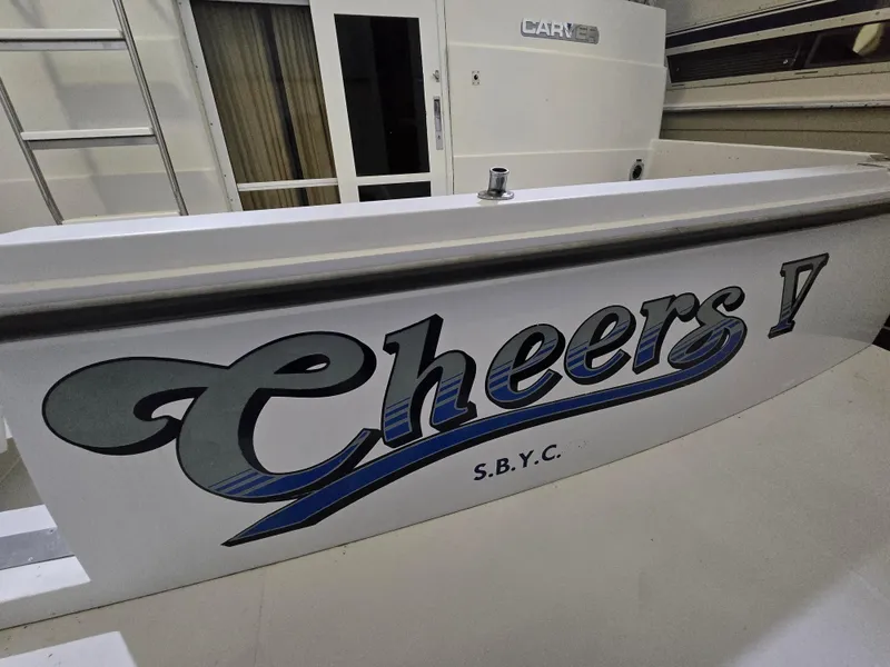 Slide: The Image of 1994 Carver 390 boat with "Cheers" and "S.B.Y.C." lettering on the stern. - 15