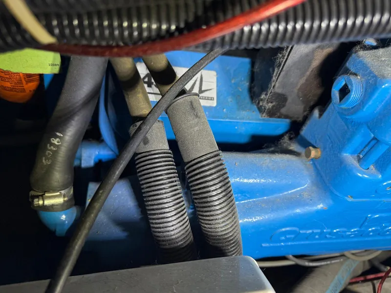 Slide: The Image of Close-up of a 1994 Carver 390 engine with visible hoses and wiring. - 8