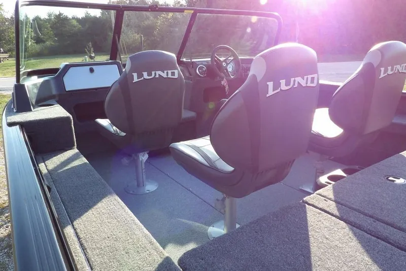 Slide: The Image of Interior of 2026 Lund 1775 Impact XS Sport boat with cushioned seating. - 19
