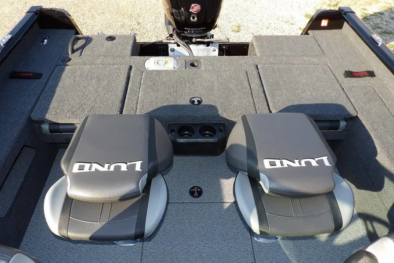 Slide: The Image of 2026 Lund 1775 Impact XS Sport boat interior with two seats and storage compartments. - 25