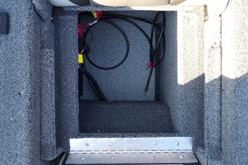 Slide: The Image of Interior storage compartment of 2026 Lund 1775 Impact XS Sport boat. - 27