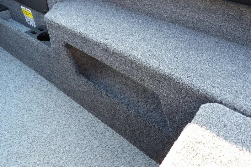 Slide: The Image of 2026 Lund 1775 Impact XS Sport boat interior with carpeted storage compartment. - 28