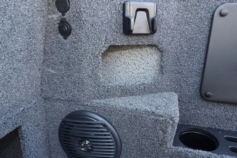 Slide: The Image of Interior detail of 2026 Lund 1775 Impact XS Sport boat, featuring speaker and textured surfaces. - 32
