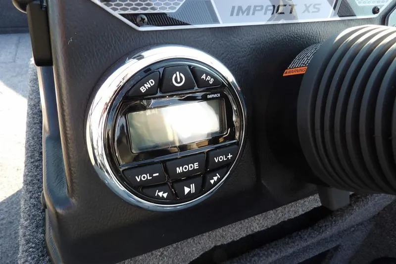 Slide: The Image of Control panel of 2026 Lund 1775 Impact XS Sport boat, featuring audio system controls. - 34