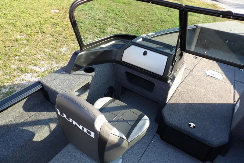 Slide: The Image of 2026 Lund 1775 Impact XS Sport boat interior with seating and storage compartments. - 37