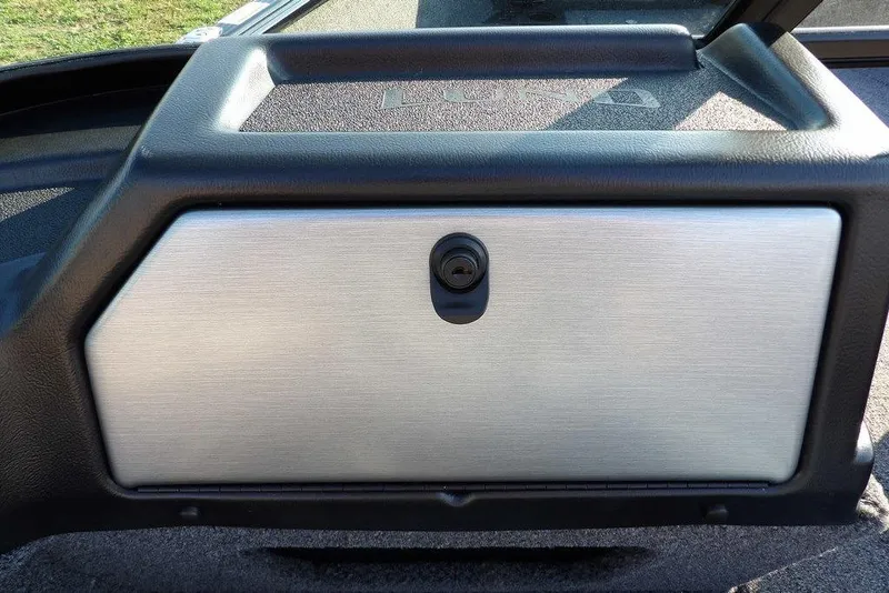 Slide: The Image of 2026 Lund 1775 Impact XS Sport boat dashboard with lockable compartment. - 38