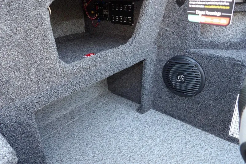 Slide: The Image of 2026 Lund 1775 Impact XS Sport interior with speaker and storage compartment. - 41