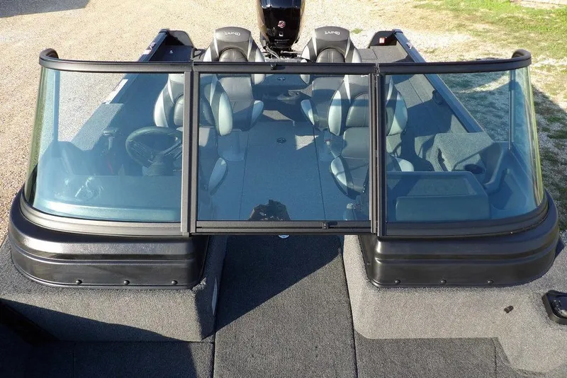 Slide: The Image of 2026 Lund 1775 Impact XS Sport boat interior with seating and windshield. - 45