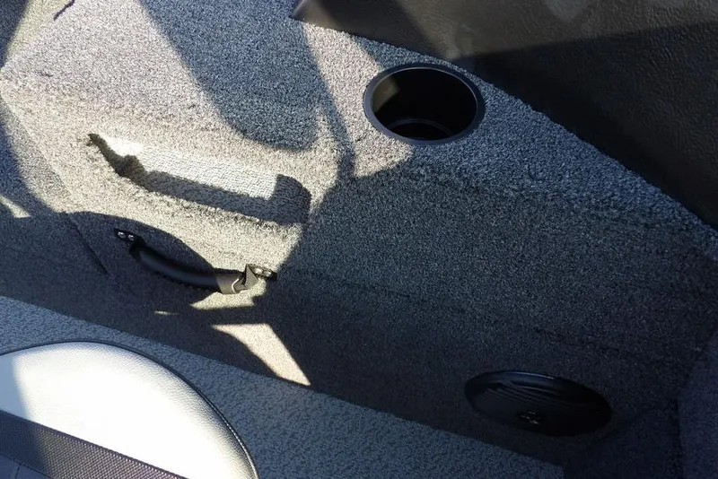 Slide: The Image of Interior of 2026 Lund 1775 Impact XS Sport boat with cup holder and handle. - 46