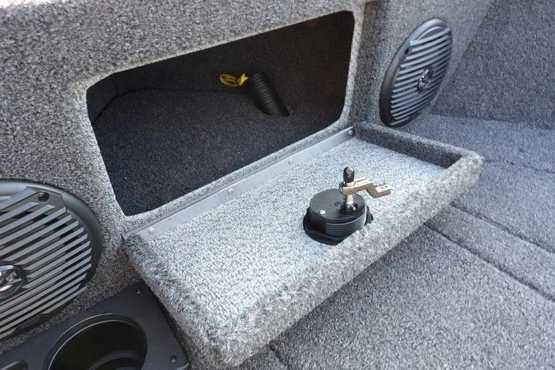 Slide: The Image of Interior of 2026 Lund 1775 Impact XS Sport boat with storage compartment and speakers. - 55