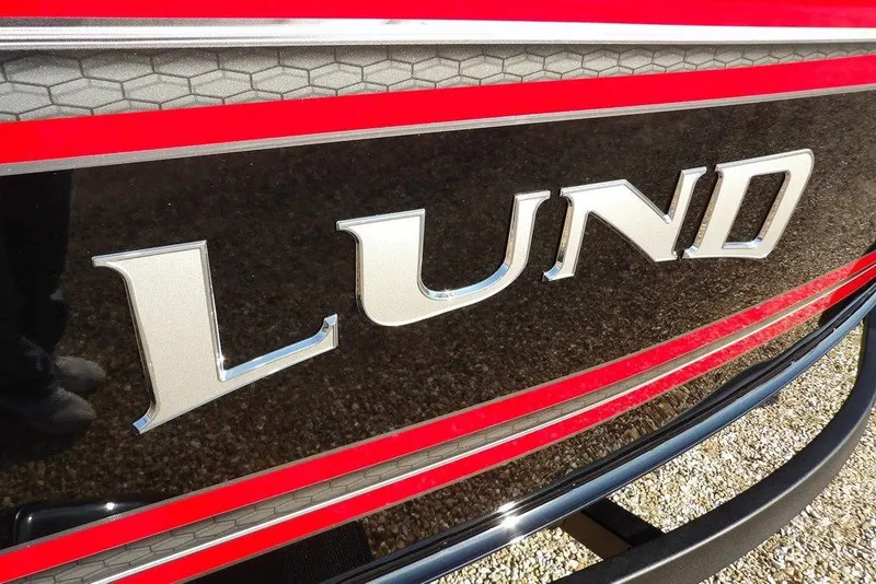 Slide: The Image of Close-up of 2026 Lund 1775 Impact XS Sport boat logo with red and black detailing. - 59