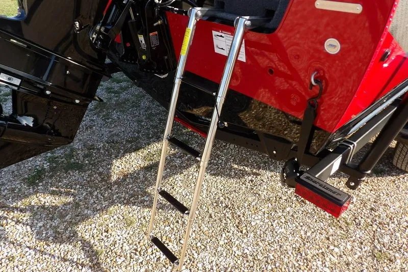Slide: The Image of Lund 1775 Impact XS Sport 2026 boat ladder on gravel surface. - 6