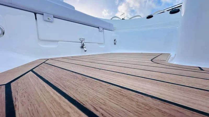 Slide: The Image of 2024 Aqvaboats LUXRIB 14 with teak deck and white seating. - 9