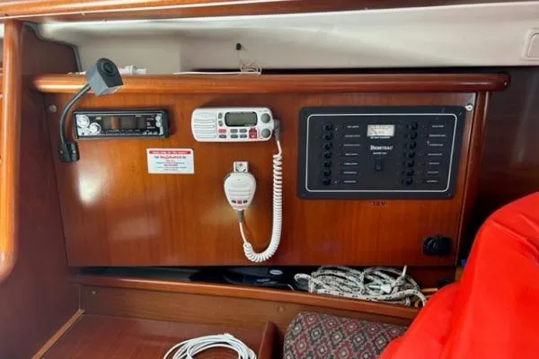 Slide: The Image of 2003 Beneteau 331 yacht control panel with radio and electrical switches. - 19