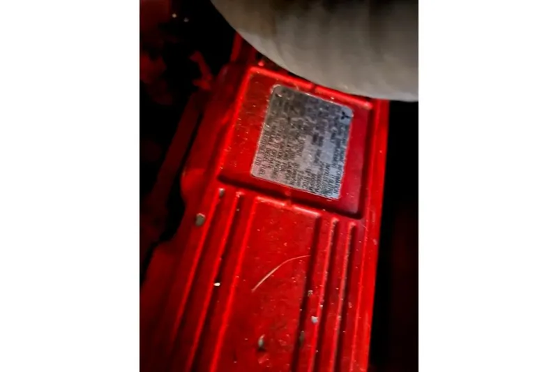 Slide: The Image of Red engine component of a 2003 Beneteau 331 sailboat. - 23