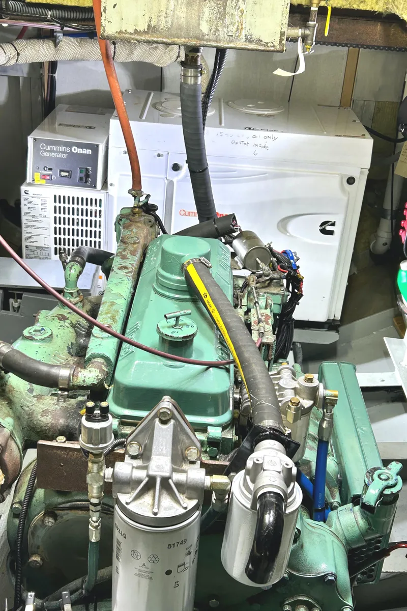 Slide: The Image of Engine room of a 1993 Custom Steel Trawler with Cummins Onan generator. - 42