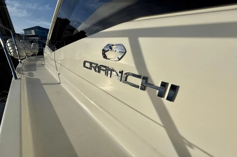 Slide: The Image of 2016 Cranchi M 44 HT yacht, side view with logo in sunlight. - 17