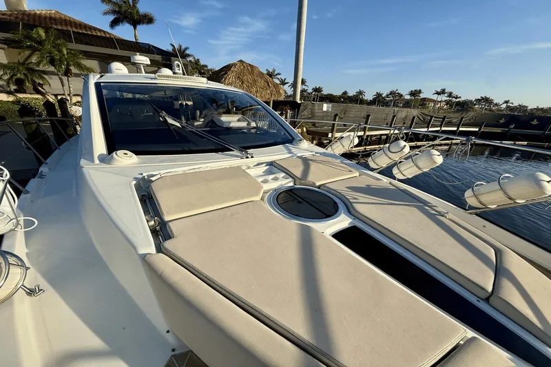 Slide: The Image of 2016 Cranchi M 44 HT yacht docked, featuring sleek design and spacious deck. - 20