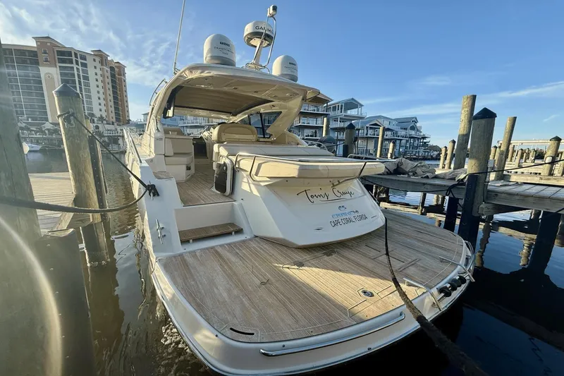 Slide: The Image of 2016 Cranchi M 44 HT yacht docked at marina with clear blue sky. - 23