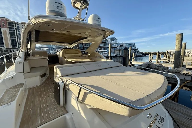 Slide: The Image of 2016 Cranchi M 44 HT yacht docked, featuring spacious deck and luxurious seating. - 24