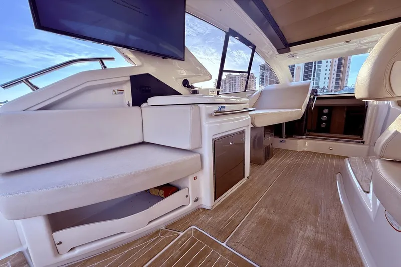 Slide: The Image of Interior of 2016 Cranchi M 44 HT yacht with modern seating and wood flooring. - 29