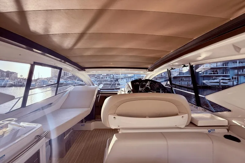 Slide: The Image of Interior view of 2016 Cranchi M 44 HT yacht, featuring luxurious seating and helm. - 30
