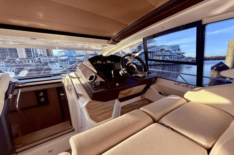 Slide: The Image of Interior of 2016 Cranchi M 44 HT yacht with luxurious helm and waterfront view. - 32