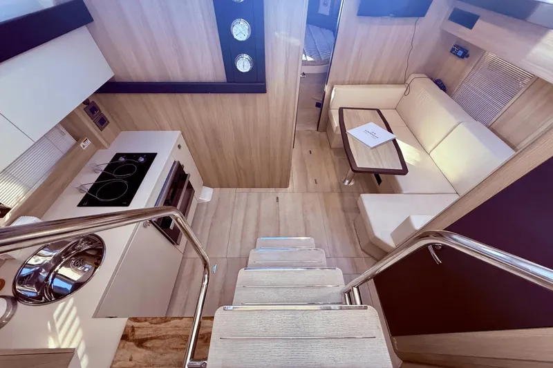Slide: The Image of Interior of 2016 Cranchi M 44 HT yacht with modern kitchen and cozy seating area. - 35