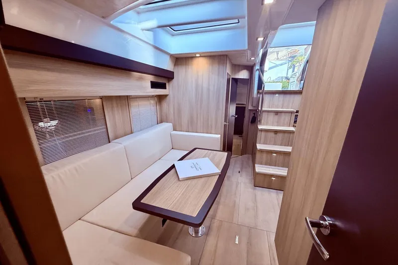 Slide: The Image of Luxurious interior of 2016 Cranchi M 44 HT yacht with modern seating and wooden finishes. - 38