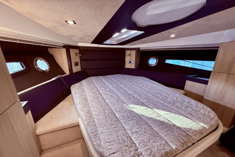 Slide: The Image of Luxurious interior cabin of 2016 Cranchi M 44 HT yacht with elegant bedding. - 40