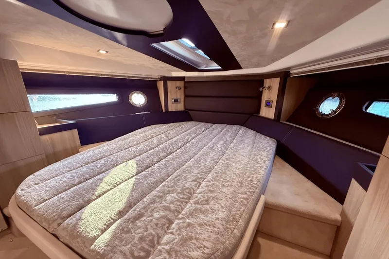 Slide: The Image of Luxurious interior cabin of 2016 Cranchi M 44 HT yacht with elegant bedding. - 42