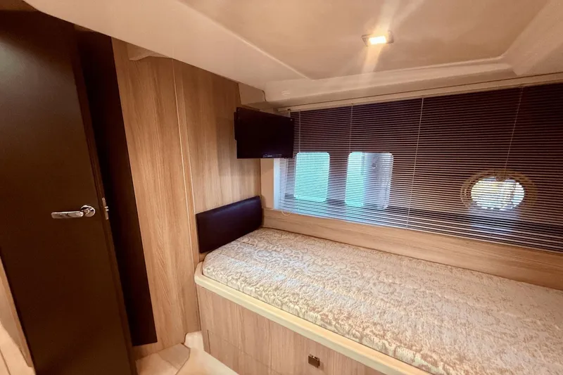 Slide: The Image of Interior cabin of 2016 Cranchi M 44 HT yacht with bed and window blinds. - 44