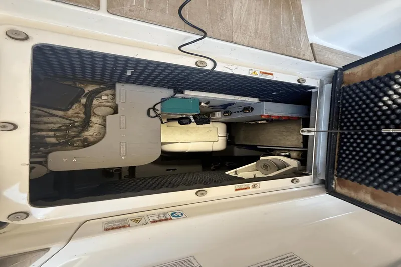 Slide: The Image of Engine compartment of 2016 Cranchi M 44 HT yacht, showcasing mechanical components and wiring. - 49