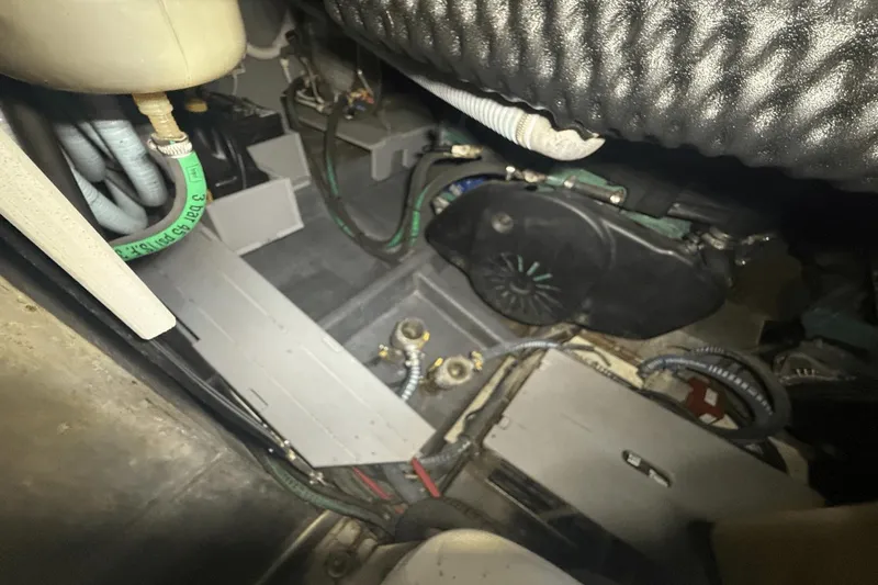 Slide: The Image of Engine compartment of a 2016 Cranchi M 44 HT yacht, showcasing hoses and mechanical components. - 51