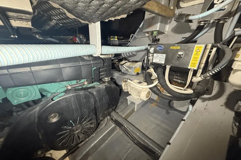 Slide: The Image of Engine room of 2016 Cranchi M 44 HT yacht, showcasing mechanical components and wiring. - 53