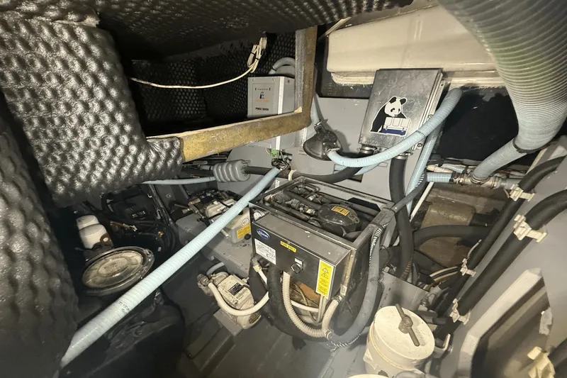 Slide: The Image of Engine room of 2016 Cranchi M 44 HT yacht with various mechanical components. - 56