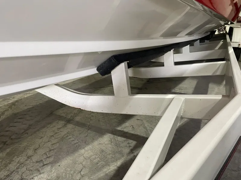 Slide: The Image of 1995 Fountain 38 Sport Cruiser on a boat trailer, close-up view. - 11