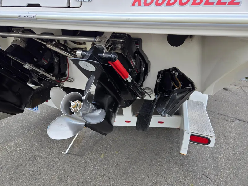 Slide: The Image of 1995 Fountain 38 Sport Cruiser boat propeller and stern drive on trailer. - 13