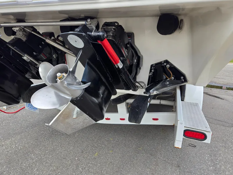 Slide: The Image of 1995 Fountain 38 Sport Cruiser boat propeller and stern on trailer. - 14