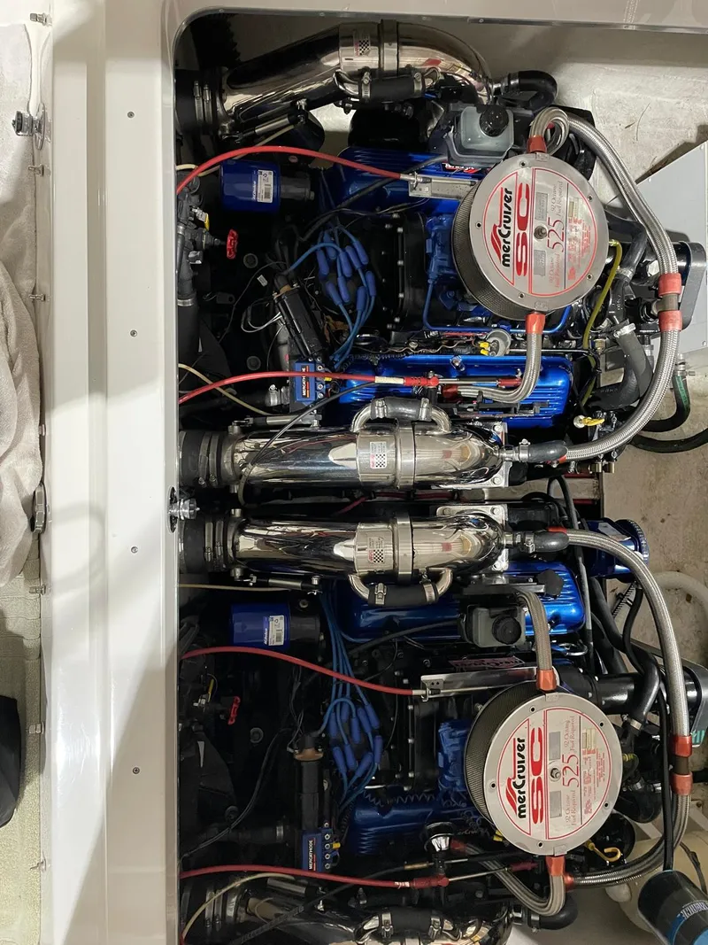 Slide: The Image of 1995 Fountain 38 Sport Cruiser engine compartment with dual Mercury engines. - 17