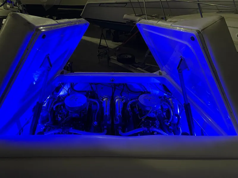 Slide: The Image of 1995 Fountain 38 Sport Cruiser engine compartment illuminated with blue lighting. - 18