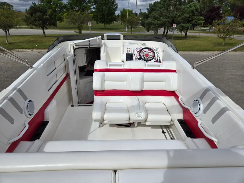 Slide: The Image of 1995 Fountain 38 Sport Cruiser interior with white and red seating, steering wheel, and dashboard. - 20