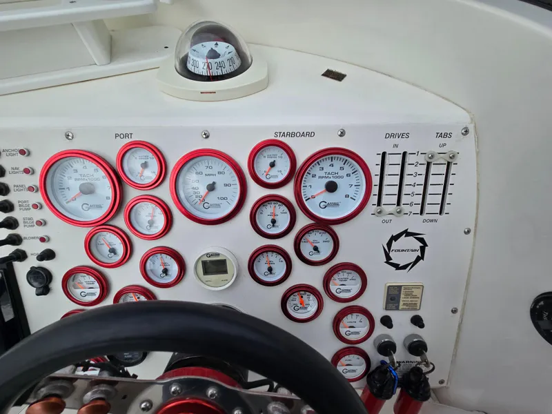 Slide: The Image of Dashboard of a 1995 Fountain 38 Sport Cruiser with gauges and controls. - 31